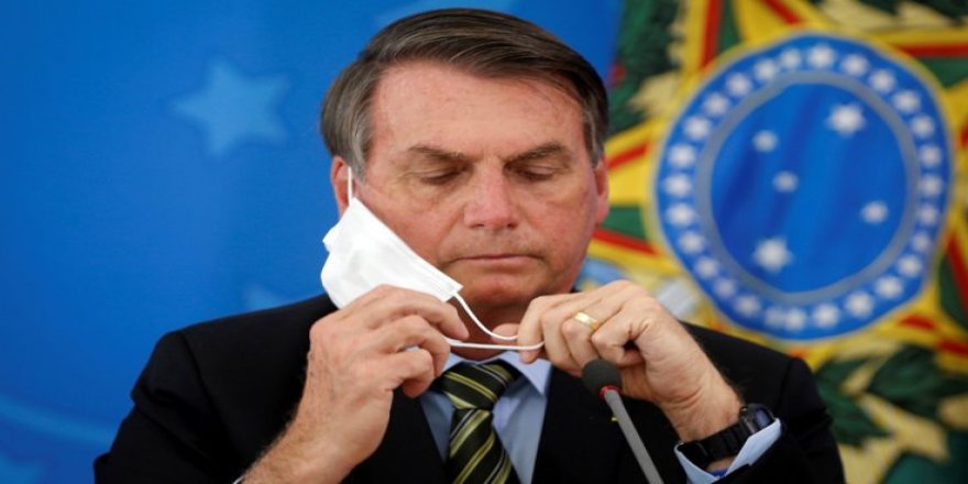 Maskesini çıkaran Bolsonaro'ya gazetecilerden dava