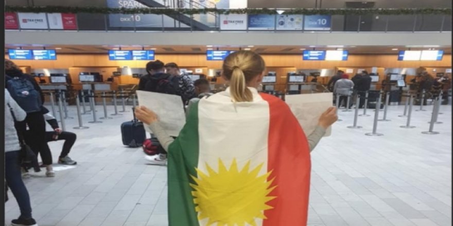 İsveç'li kadın aktivistten THY önünde Kürdistan bayraklı protesto